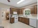 Functional kitchen with ample counter space, white appliances, and dark cabinets at 175 N Unity Grove Rd, Locust Grove, GA 30248
