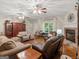 Spacious living room features hardwood floors, fireplace, and comfortable seating at 175 N Unity Grove Rd, Locust Grove, GA 30248