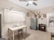 Functional room with neutral tones, offering ample natural light, desk and safe for secure storage solutions at 175 N Unity Grove Rd, Locust Grove, GA 30248