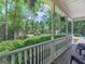 Covered porch area with seating and views of the landscaped front yard at 175 N Unity Grove Rd, Locust Grove, GA 30248