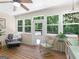 Sunroom featuring wood floors, large windows, and lots of natural light at 175 N Unity Grove Rd, Locust Grove, GA 30248