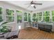Sunroom featuring wood floors and large windows that brings in lots of natural light at 175 N Unity Grove Rd, Locust Grove, GA 30248