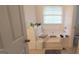 Bathroom featuring a tub with a large window, and a tiled shower area at 11950 Markham Way, Hampton, GA 30228