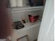 Walk-in closet with wire shelving used for storage; shelves on back of door at 11950 Markham Way, Hampton, GA 30228