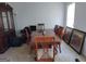 Spacious dining room featuring a classic wood table with ornate chairs at 11950 Markham Way, Hampton, GA 30228