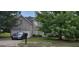 Charming brick home with a two-car garage and lush green lawn at 11950 Markham Way, Hampton, GA 30228
