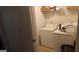 Laundry room with a washing machine, dryer, and shelving for storage at 11950 Markham Way, Hampton, GA 30228
