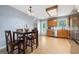 Eat-in kitchen with wood cabinetry, stainless steel appliances, and access to backyard at 100 Gum Creek Landing, Oxford, GA 30054