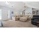 Spacious living room features a large sectional, vaulted ceiling, and front door access at 100 Gum Creek Landing, Oxford, GA 30054