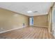 An empty basement featuring plank floors, neutral colored walls, drop ceiling and an exterior door at 175 Dove Pt, Covington, GA 30016