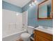 Bathroom featuring vanity, toilet, and bathtub with shower head at 175 Dove Pt, Covington, GA 30016
