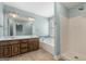 Bathroom featuring double sink vanity, soaking tub, and shower at 175 Dove Pt, Covington, GA 30016