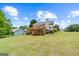 Back of house featuring a large wooden deck, screened in porch, and lush backyard at 175 Dove Pt, Covington, GA 30016
