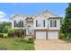 Charming two-story home features a brick-accented facade, two-car garage, and well-maintained landscaping at 175 Dove Pt, Covington, GA 30016