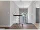 View of the front door entrance and staircase with hardwood flooring and neutral paint at 175 Dove Pt, Covington, GA 30016
