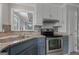 Kitchen featuring granite counters, stainless steel appliances, neutral paint and mosaic backsplash at 175 Dove Pt, Covington, GA 30016