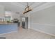 Well-lit kitchen features stainless steel appliances, granite counters, and an island with bar seating at 175 Dove Pt, Covington, GA 30016