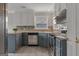 Kitchen featuring granite counters, stainless steel appliances, neutral paint and mosaic backsplash at 175 Dove Pt, Covington, GA 30016