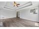 Spacious living room with hardwood floors, ceiling fan, and neutral walls, great for entertaining at 175 Dove Pt, Covington, GA 30016