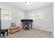 Cozy bedroom featuring neutral walls, a window view, and a dedicated workspace area with multiple monitors at 2425 Clifton Springs Rd, Decatur, GA 30034