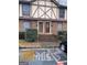 Charming exterior of a multi-Gathering building with brick facade and Tudor-style accents at 3189 Abbeywood Dr, Decatur, GA 30034