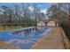 Community pool with winter cover and Tudor style pool house offers recreation and relaxation at 3189 Abbeywood Dr, Decatur, GA 30034