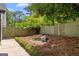 Serene backyard featuring lush greenery, decorative rock garden, and privacy fencing perfect for relaxation at 332 Judy Dr, Mcdonough, GA 30253