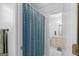 Bathroom showcasing a blue shower curtain, a toilet, and a vanity at 332 Judy Dr, Mcdonough, GA 30253