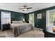 Serene bedroom with carpet, a ceiling fan, windows with natural light, and coordinated decor at 332 Judy Dr, Mcdonough, GA 30253