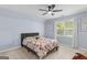 Carpeted bedroom with natural light and a comfortable queen-sized bed at 332 Judy Dr, Mcdonough, GA 30253