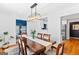 Elegant dining room with a stylish chandelier, hardwood floors, and a view to the kitchen at 332 Judy Dr, Mcdonough, GA 30253
