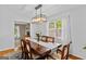Bright dining room featuring natural light, hardwood floors, and space for Gathering gatherings at 332 Judy Dr, Mcdonough, GA 30253