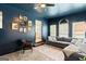 Cozy living room with lots of natural light, comfortable seating, and gallery wall decor at 332 Judy Dr, Mcdonough, GA 30253