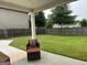Relax on the patio in a spacious backyard surrounded by a wood fence and mature trees at 3970 Lagrone St, Powder Springs, GA 30127