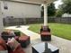 Enjoy outdoor living on this patio with cozy seating and a manicured lawn, perfect for entertaining at 3970 Lagrone St, Powder Springs, GA 30127