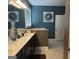 Elegant bathroom featuring double vanity sinks, a window, and designer accents at 3970 Lagrone St, Powder Springs, GA 30127