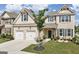 Charming brick two-story home with a well-manicured lawn, two-car garage and attractive architectural details at 3970 Lagrone St, Powder Springs, GA 30127