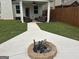 Backyard with fire pit, walkway and covered patio seating area, perfect for outdoor gatherings at 3970 Lagrone St, Powder Springs, GA 30127