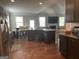 A kitchen overlooks the dining and living room in an open concept living space at 3970 Lagrone St, Powder Springs, GA 30127