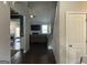 Open-concept living room with hardwood floors, a ceiling fan, and view of a dining space at 3970 Lagrone St, Powder Springs, GA 30127