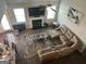 A birds eye view of the living room featuring a large sectional sofa and fireplace at 3970 Lagrone St, Powder Springs, GA 30127
