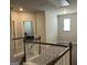 Upstairs loft area showcasing the staircase and a view into one of the bedrooms at 3970 Lagrone St, Powder Springs, GA 30127