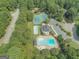 Aerial view of community amenities including two pools and tennis courts at 218 Woodruff Way, Peachtree City, GA 30269