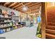 Unfinished basement with concrete floor, wooden beams and shelving at 218 Woodruff Way, Peachtree City, GA 30269
