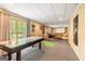 The finished basement has an air hockey table, putting green, and basketball hoop for entertainment at 218 Woodruff Way, Peachtree City, GA 30269