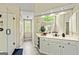 Bathroom boasts a glass shower, double vanity, and large window with natural light at 218 Woodruff Way, Peachtree City, GA 30269