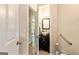 Half bathroom featuring a vanity sink, dark cabinetry, and brushed nickel hardware at 218 Woodruff Way, Peachtree City, GA 30269