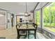 Dining area with view to the kitchen, with natural light and neutral colors at 218 Woodruff Way, Peachtree City, GA 30269