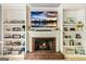 Cozy fireplace surrounded by custom built-in shelving at 218 Woodruff Way, Peachtree City, GA 30269