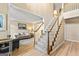 Spacious foyer features hardwood floors, staircase, and an inviting view of the living room beyond at 218 Woodruff Way, Peachtree City, GA 30269